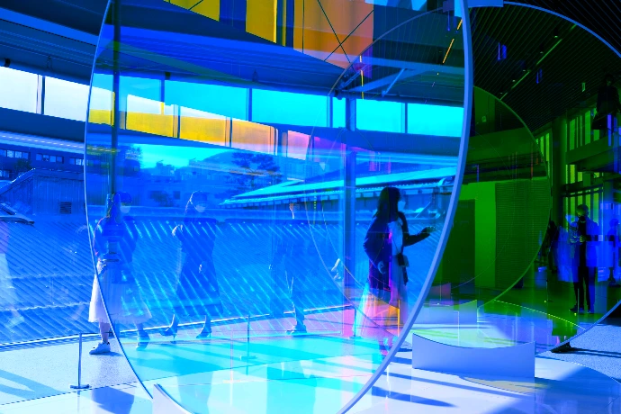 a group of people standing inside of a building