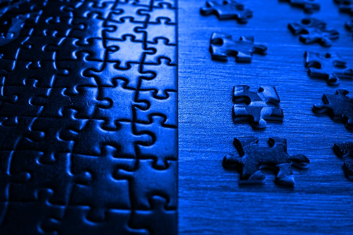 a close up of a puzzle on a table
